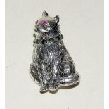 Silver cat brooch with ruby eyes and emerald collar