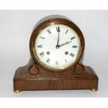 Comitti Oak Clock fitted with two train movement striking on a bell on raised bun feet