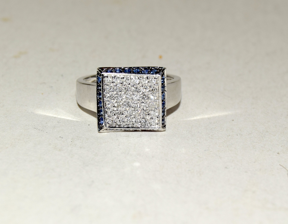 14ct white gold pave set diamond ring with sapphire border