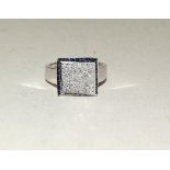 14ct white gold pave set diamond ring with sapphire border