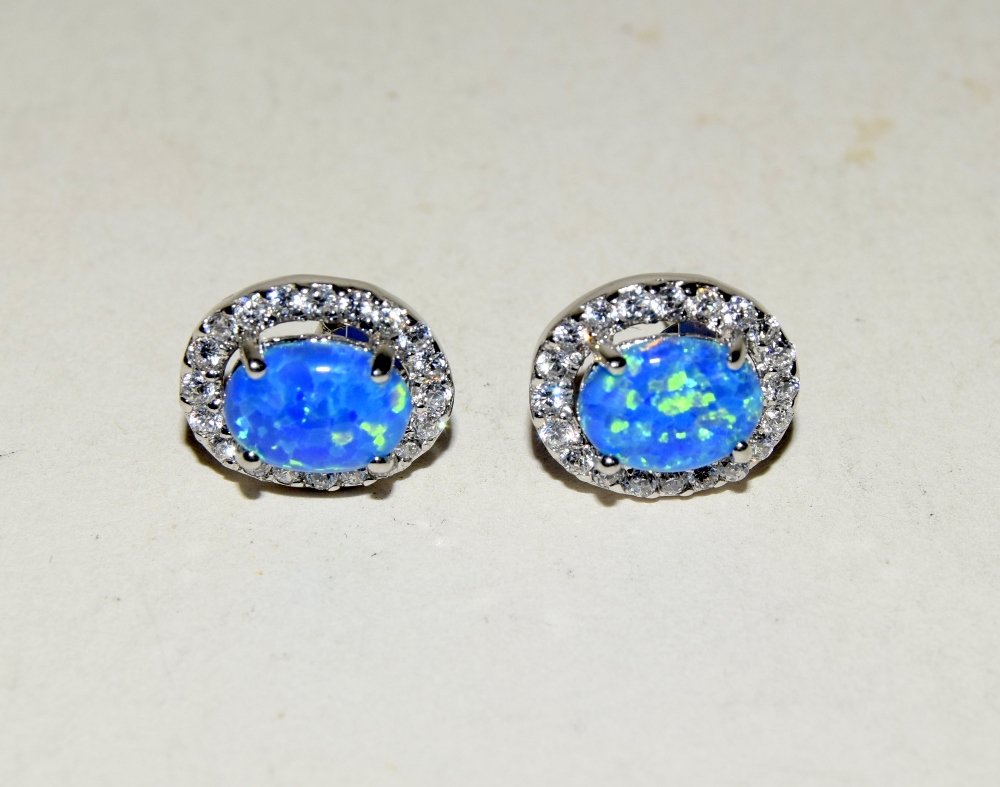 Pair of silver CZ and blue opal stud earrings