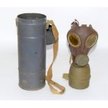 A WW2 gas mask in its metal container