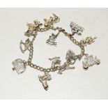 Silver charm bracelet and 11 charms