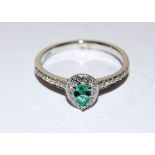 18ct white gold pear shaped emerald and diamond cluster ring of 95 points approx. Size T