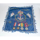 A WW2 Royal Navy medal group of four including the Atlantic Star with a souvenir embroidery of Egypt