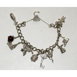 Silver charm bracelet and 10 charms