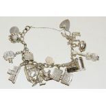 Silver charm bracelet and 14 charms