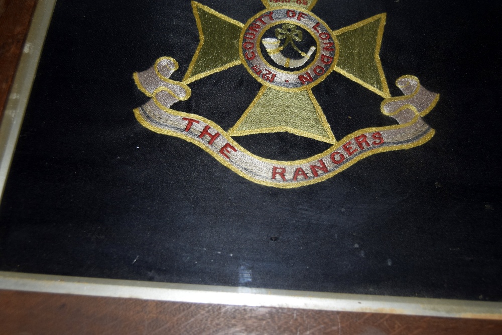 A framed and glazed woolwork embroidery of the badge of the 12th County of London Regiment The - Image 4 of 6