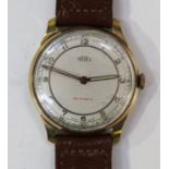 A Trebex 9ct gold circular cased gentleman's wristwatch, the signed silvered dial with Arabic