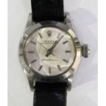 A Rolex Oyster Perpetual lady's steel circular cased wristwatch, the signed silvered dial with baton