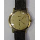 A Hefik 9ct gold circular cased gentleman's wristwatch, the signed circular dial with gilt baton