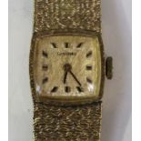 A Longines 9ct gold curved square cased lady's bracelet wristwatch, the signed textured dial with