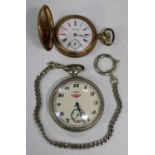 A Russian Oriosa base metal cased keyless wind open-faced pocket watch, the signed dial with black