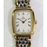 An Omega de Ville gilt metal and steel lady's bracelet wristwatch, the signed curved rectangular