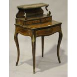 An early 20th century Louis XV style rosewood and amboyna bonheur-du-jour with overall gilt metal