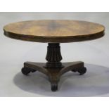 A Regency rosewood circular tip-top breakfast table, raised on a reeded baluster column and