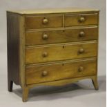 An early Victorian mahogany chest of two short and three long drawers, on splayed bracket feet,