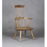 A 19th century Welsh ash and elm stick back Windsor armchair, the shaped top rail and hoop back