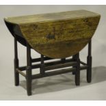 A Queen Anne oak oval gateleg table, raised on slightly splayed turned and block legs, height