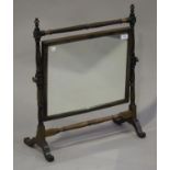 A late 19th century mahogany swing framed toilet mirror with spiral reeded and turned supports, on