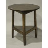 A late 18th century pine and elm circular two-tier cricket table on block legs, height 72cm,