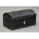 A 19th century leather bound dome topped trunk with brass studwork decoration and carrying