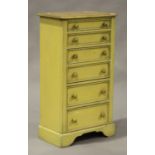 A modern cream painted pine narrow chest of six graduated drawers, on bracket fleet, height 106cm,