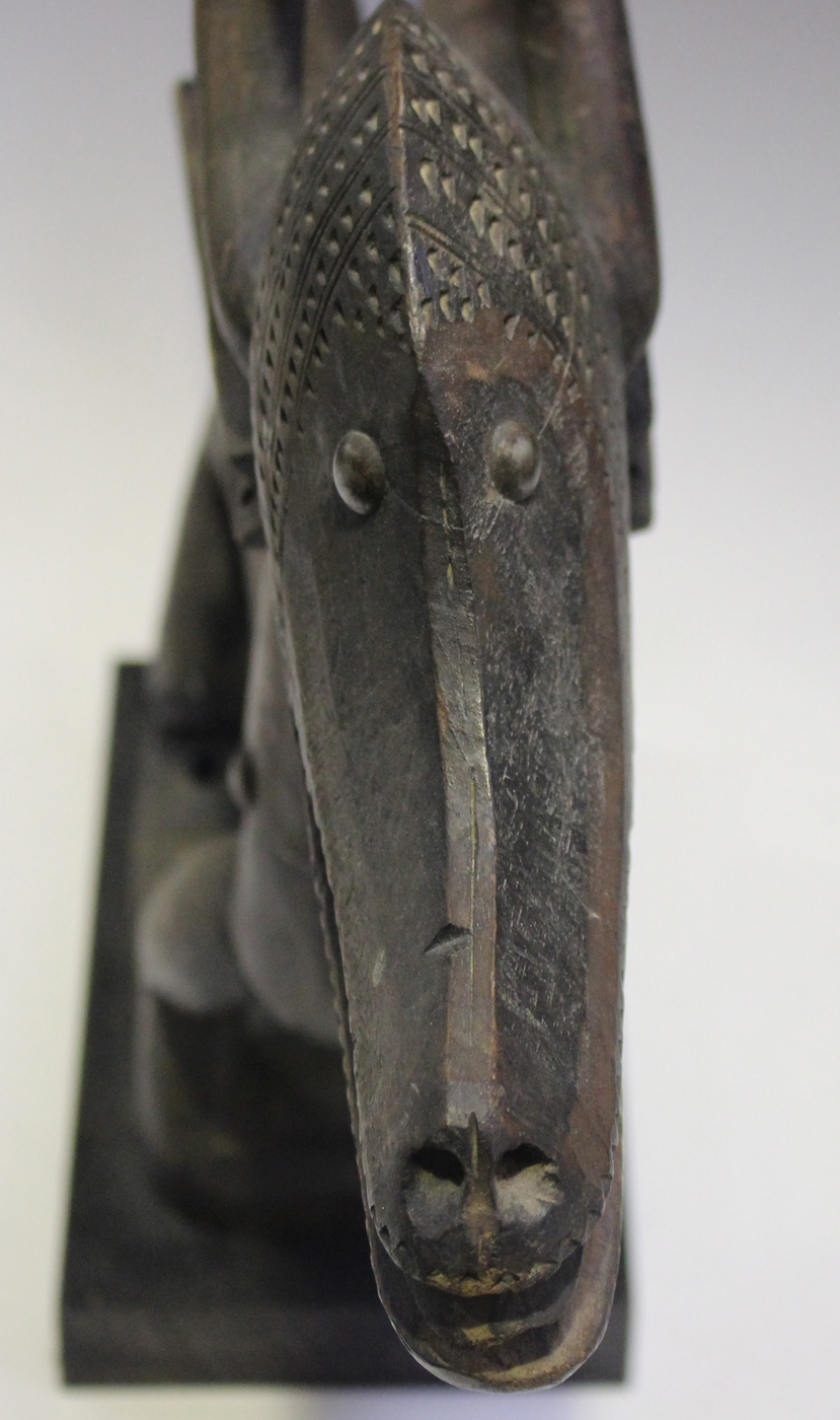 A Bamana Chiwara carved hardwood headdress, Mali, modelled in the form of a stylized antelope, - Image 5 of 6