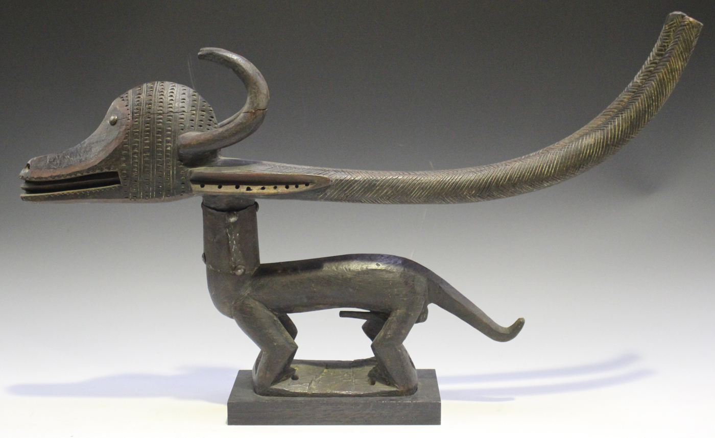 A Bamana Chiwara carved hardwood headdress, Mali, modelled in the form of a stylized antelope,