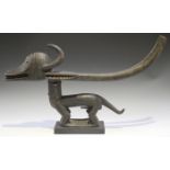 A Bamana Chiwara carved hardwood headdress, Mali, modelled in the form of a stylized antelope,
