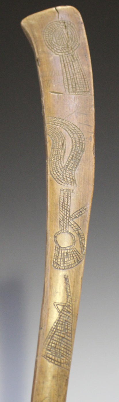An African 'gun stock' club with overall incised decoration, length 73cm, together with another - Image 2 of 3