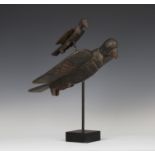 A Senufo Sejen carved and painted hardwood double bird finial, Ivory Coast, decorated with reserve