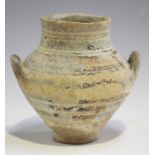 An Ancient Cypriot amphoriskos, circa 1100-1050BC, the ovoid body with two loop handles and