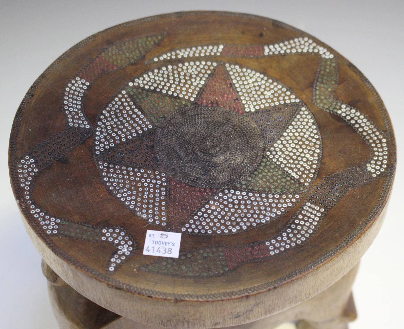 An East African carved wooden Kamba stool, Kenya, the circular seat with inset beaded decoration - Image 2 of 2