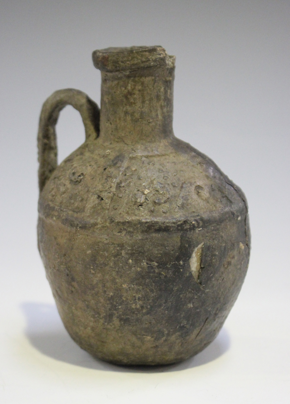 An Ancient Etruscan Bucchero ware oil jug, approx 6th century BC, the body with a loop handle, the - Image 2 of 2