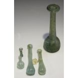 A group of mainly Roman glassware, including a tear shaped flask, inscribed to the base with Hugh