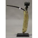 A Ngbaka harp, Democratic Republic of Congo, the double-headed mask finial above a hide-covered body