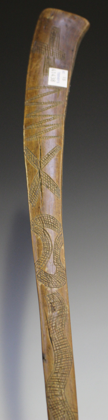 An African 'gun stock' club with overall incised decoration, length 73cm, together with another - Image 3 of 3