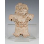 A pre-Columbian red earthenware stargazer figure, probably Mexican, modelled with beaded