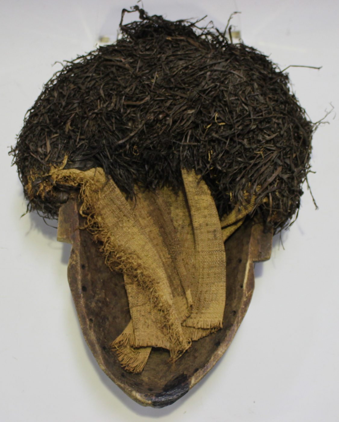 An African carved hardwood mask with painted surface and applied grass hair, possibly Xhosa, South - Image 2 of 2