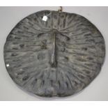 An Ethiopian animal hide shield of ribbed circular form, diameter 75.5cm.Buyer’s Premium 29.4% (