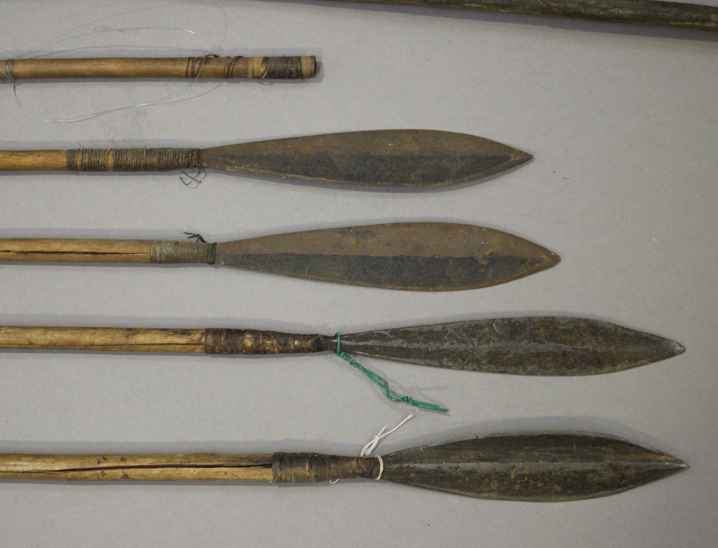 An African wooden bow, a group of five African arrows and an elephant's tail whip.Buyer’s Premium - Image 2 of 3