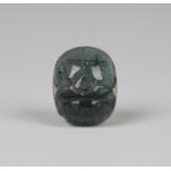 An Egyptian rock crystal scarab, naturalistically incised with wings and eyes, the underside with