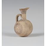 An Ancient Cypriot small terracotta barrel-shaped flask, circa 750-600BC, the flared neck and