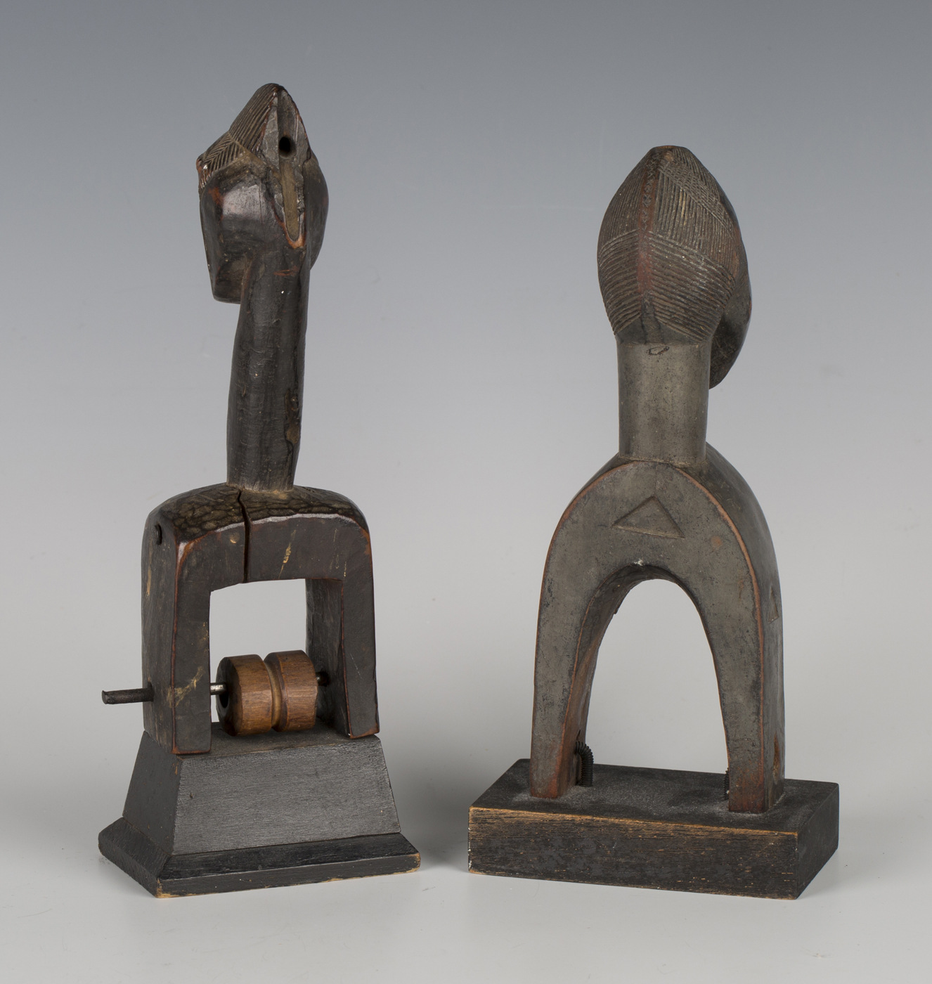 A Baule carved hardwood heddle pulley, Ivory Coast, together with another similar heddle pulley, - Image 2 of 2