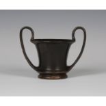 An Ancient Greek Boeotian blackware kantharos, 5th century BC, the bell shaped body flanked by a