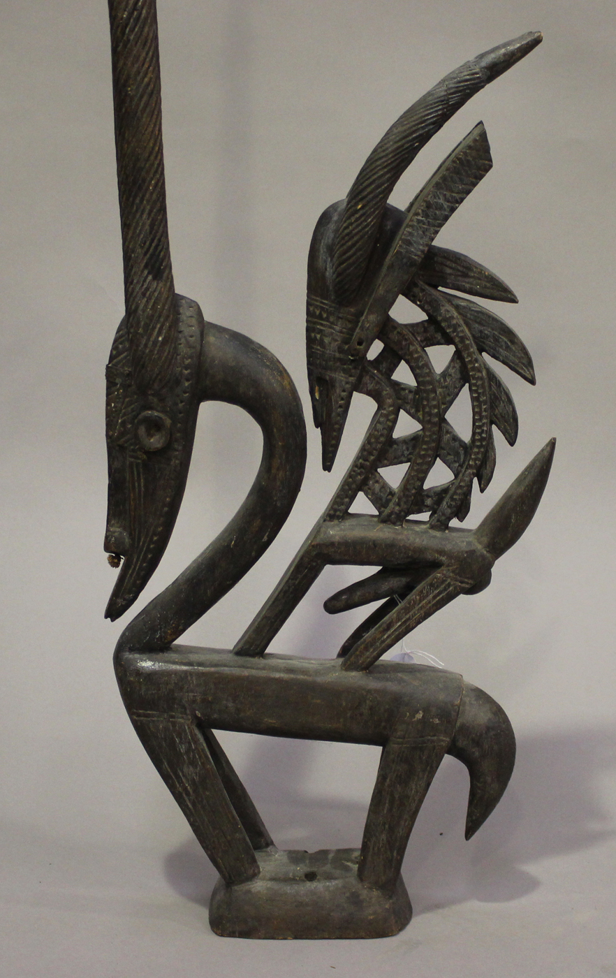 A Bamana Chiwara carved hardwood headdress, Mali, modelled vertically as two stylized antelopes, - Image 2 of 2