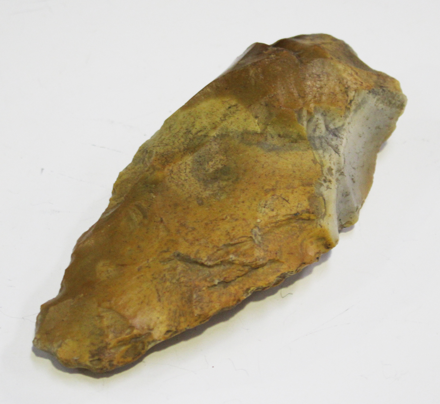 A Palaeolithic flint stone hand axe, length 14.5cm. Note: this axe was found by the family of the