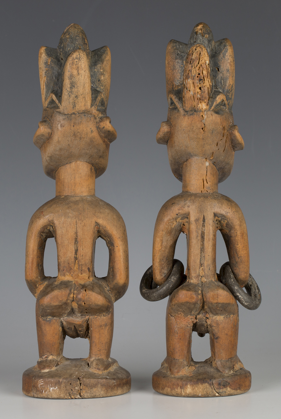 A pair of Yoruba Ere Ibeji carved wooden twin figures, modelled in the form of a male and female, - Image 2 of 2