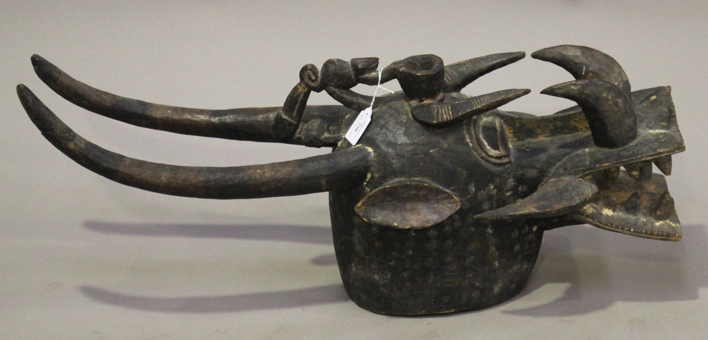 A Senufo Kponyungo carved and painted helmet mask, Ivory Coast, modelled typically in the form of - Image 4 of 4